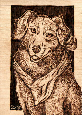 Art burned on wooden badge